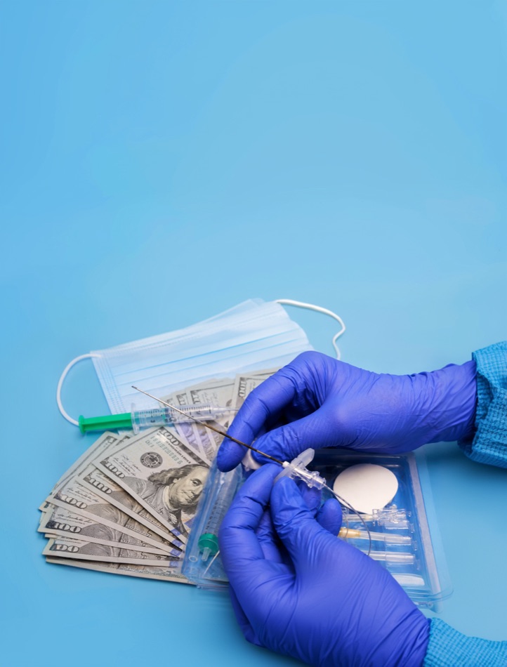 Gloved hands with cash and a syringe