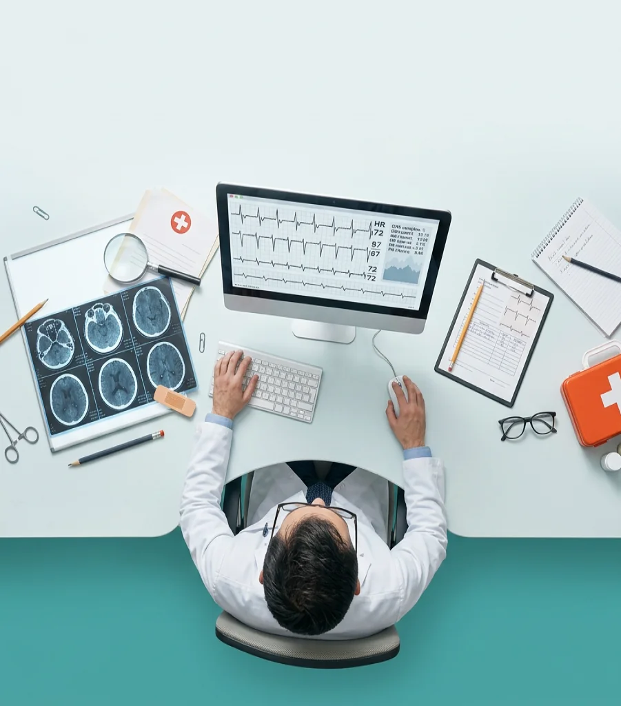 A clinician reviewing heart failure data at a desk