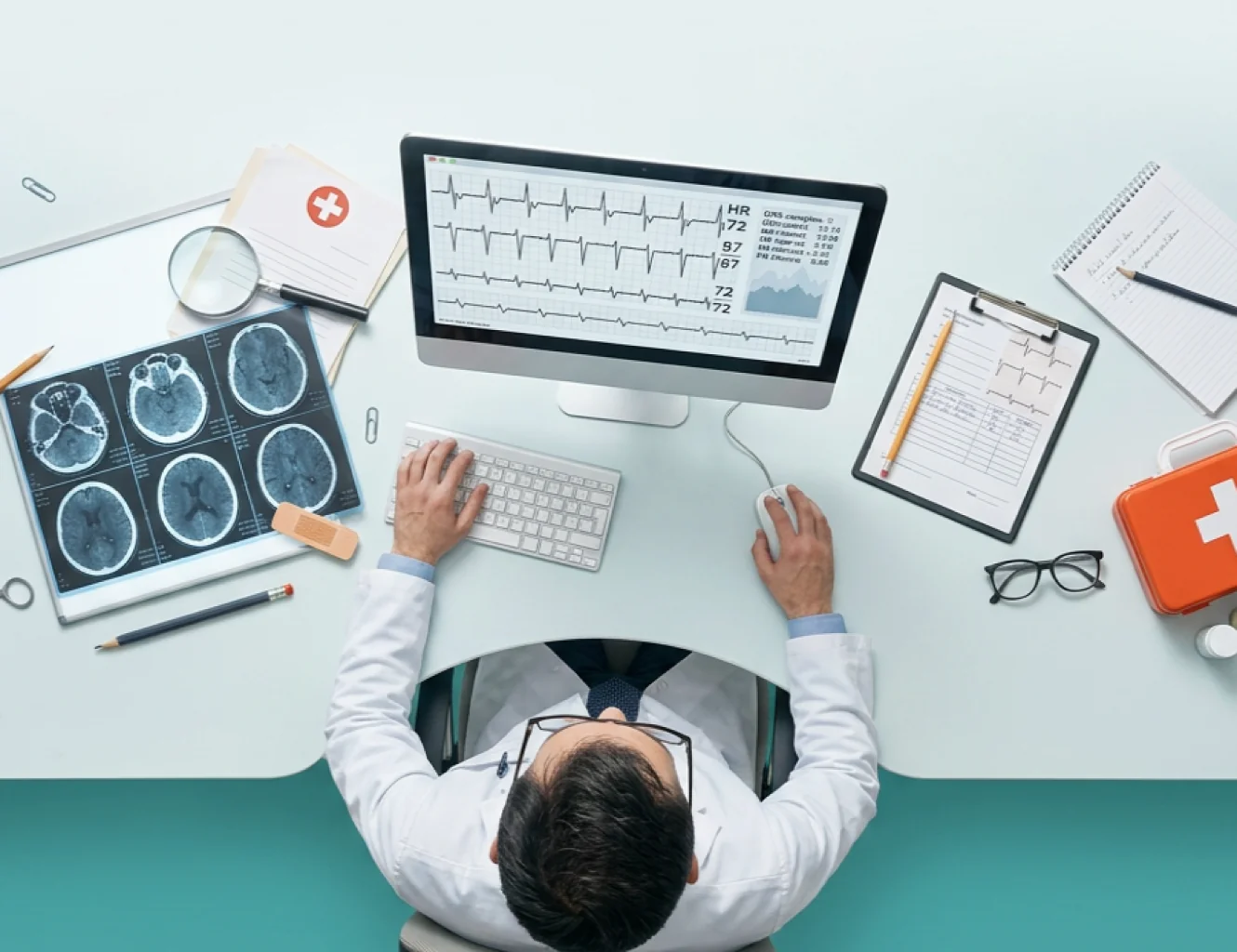 A clinician reviewing heart failure data at a desk